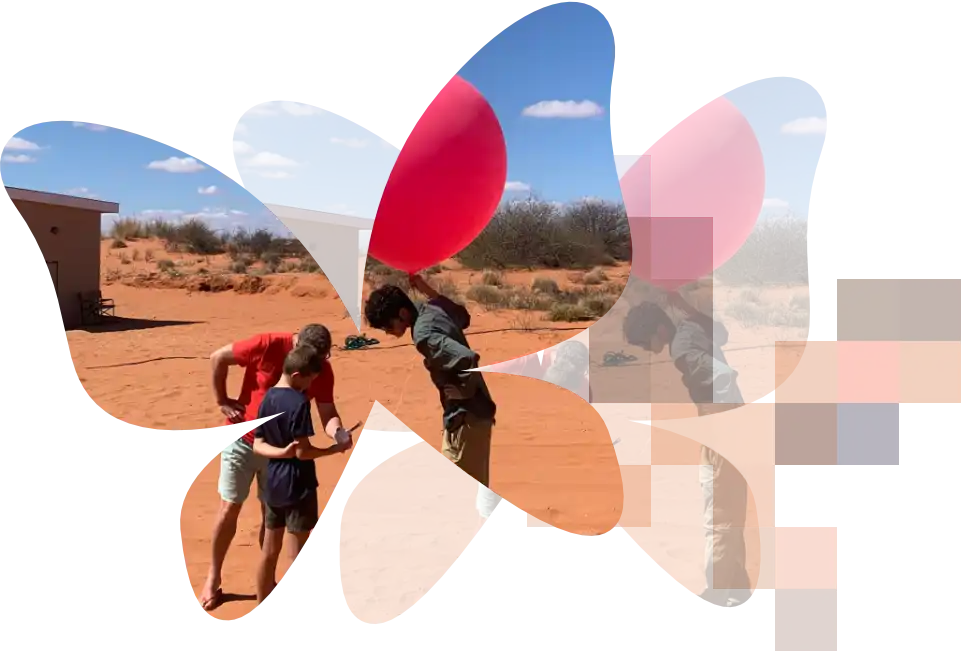 Two men with a boy and weather balloon within a clipped outline of butterflies, each becoming more pixelated.
